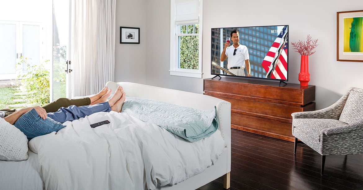 Lifestyle bedroom image, D-Series Tv showing Wolf of Wall Street